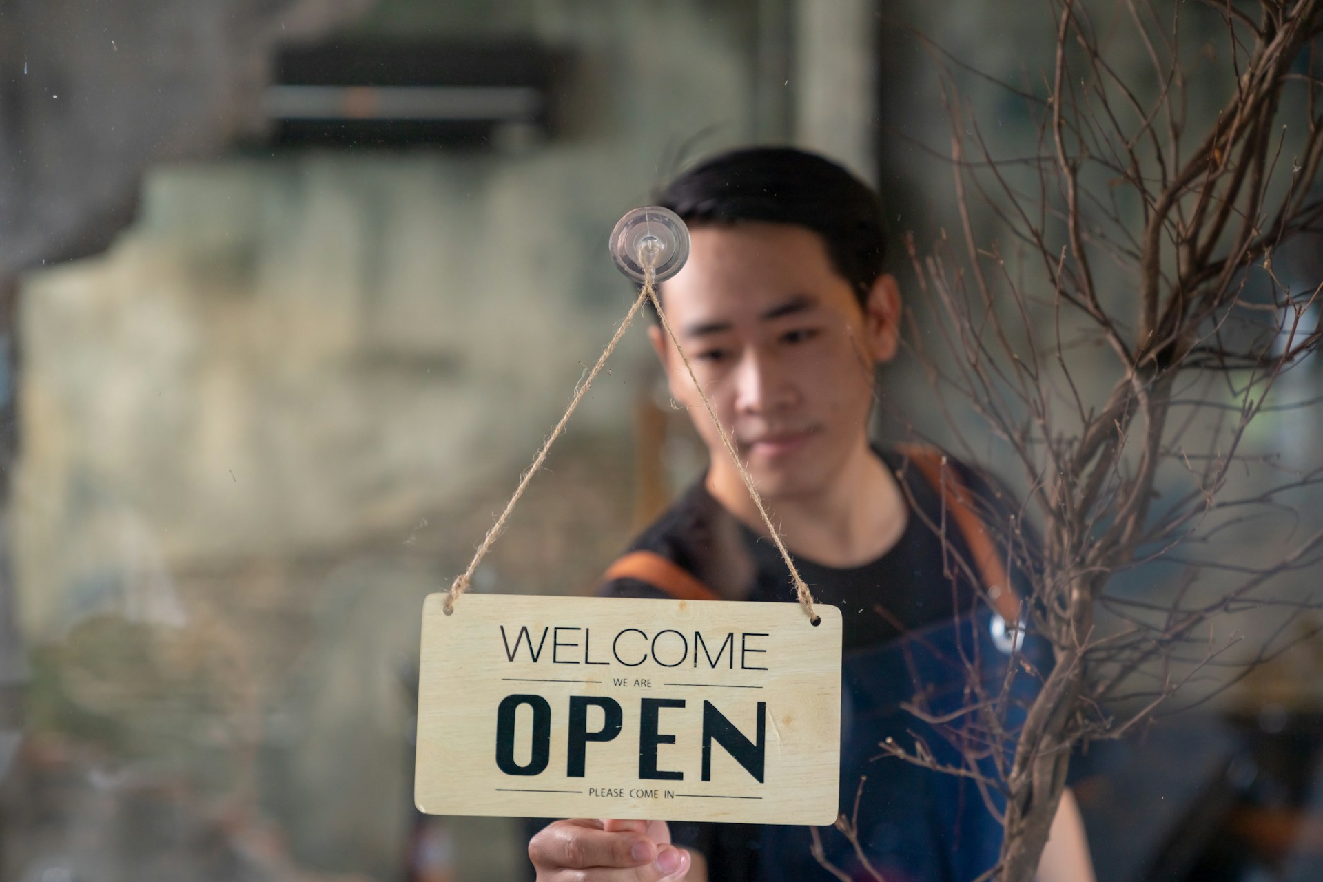 A person opening a store