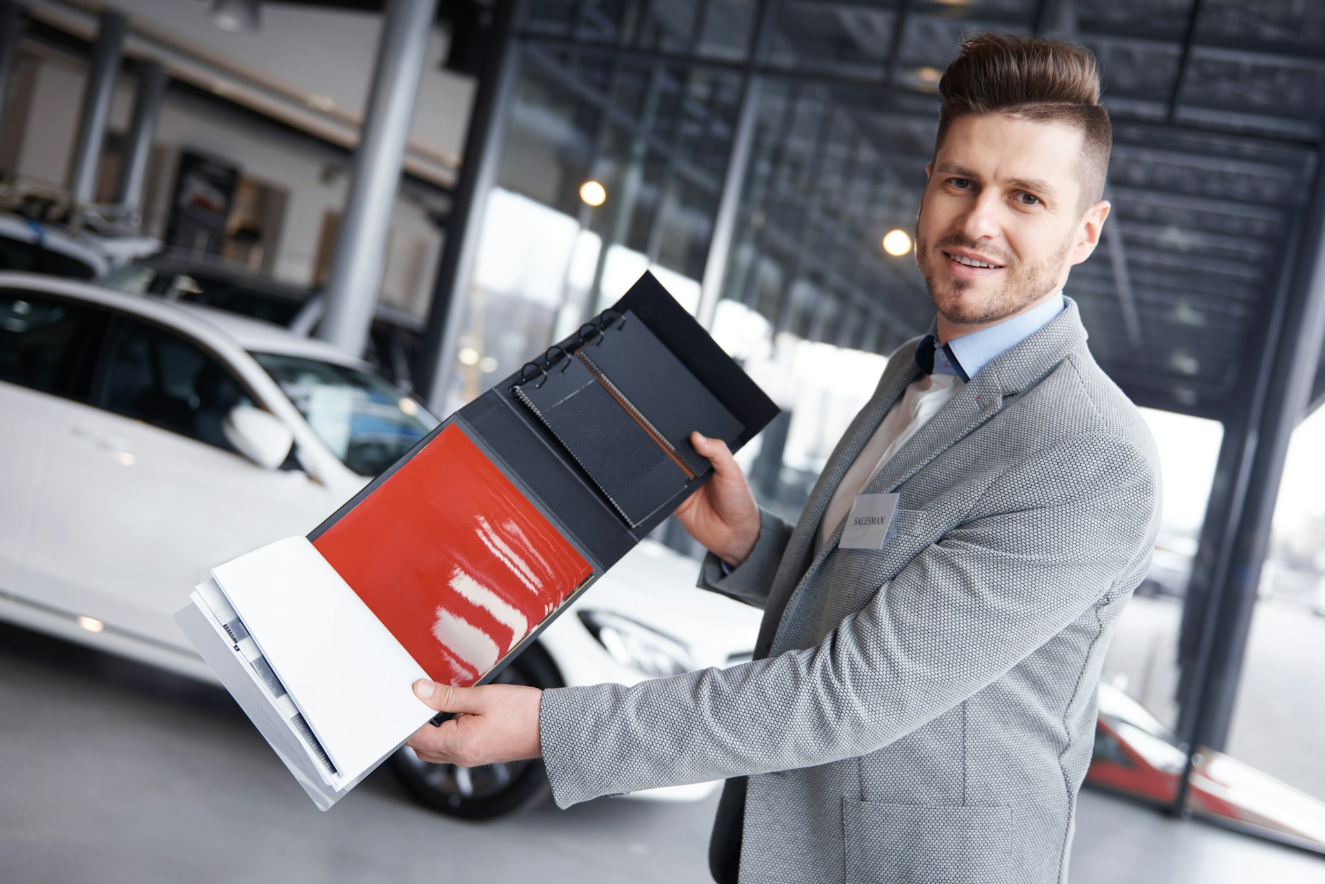 A man holding out a paper