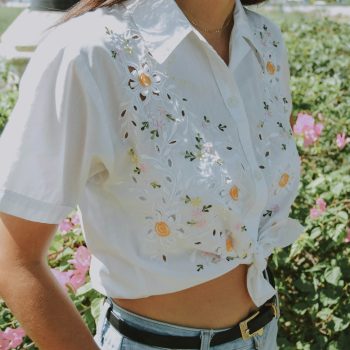 A woman wearing a white shirt